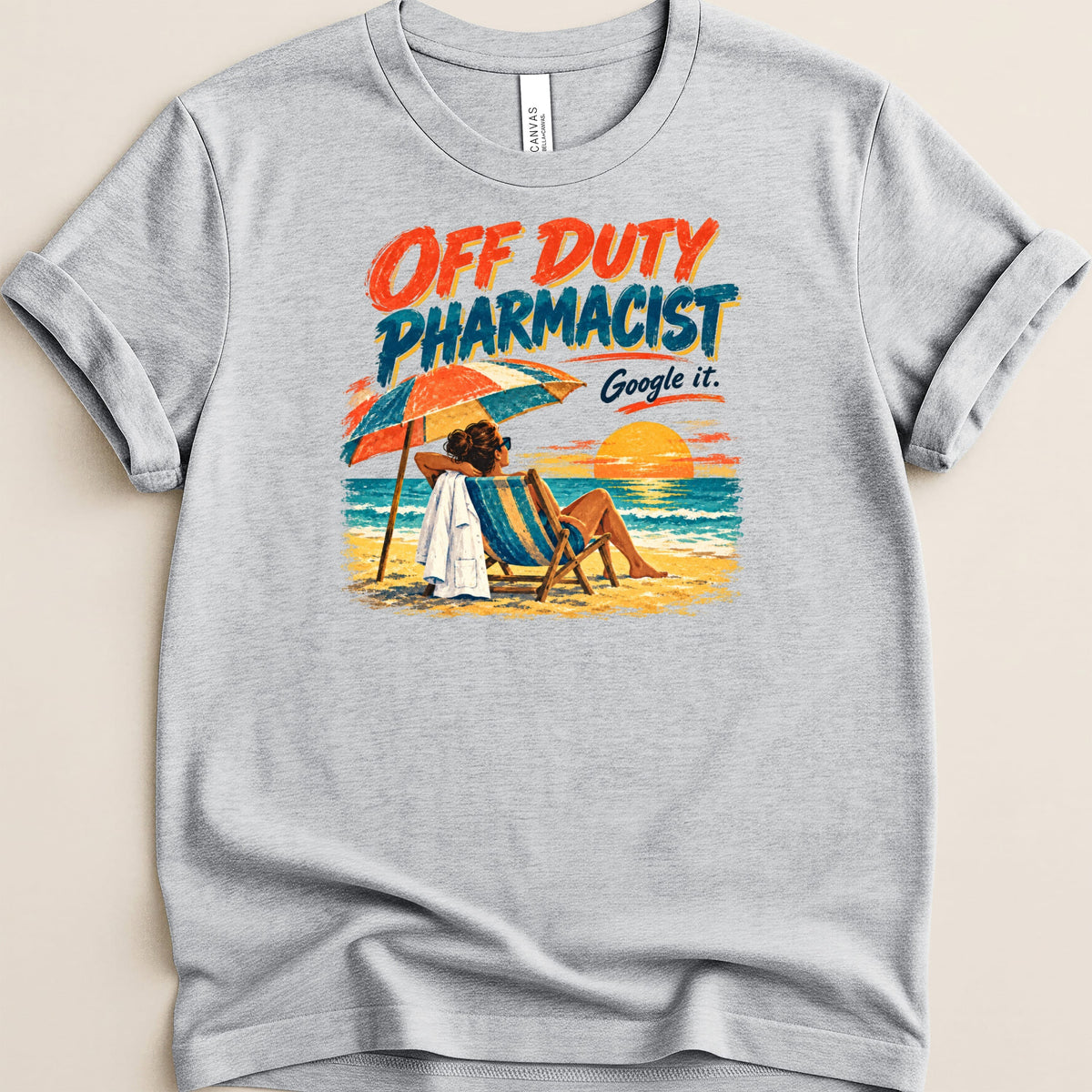 Heather gray t-shirt featuring a retro beach illustration and text that reads Off Duty Pharmacist Google it.