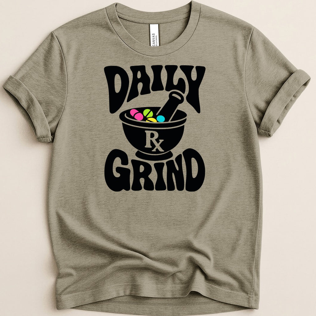 T-shirt with black graphic of mortar, pestle, pills, and slogan "Daily Rx Grind".
