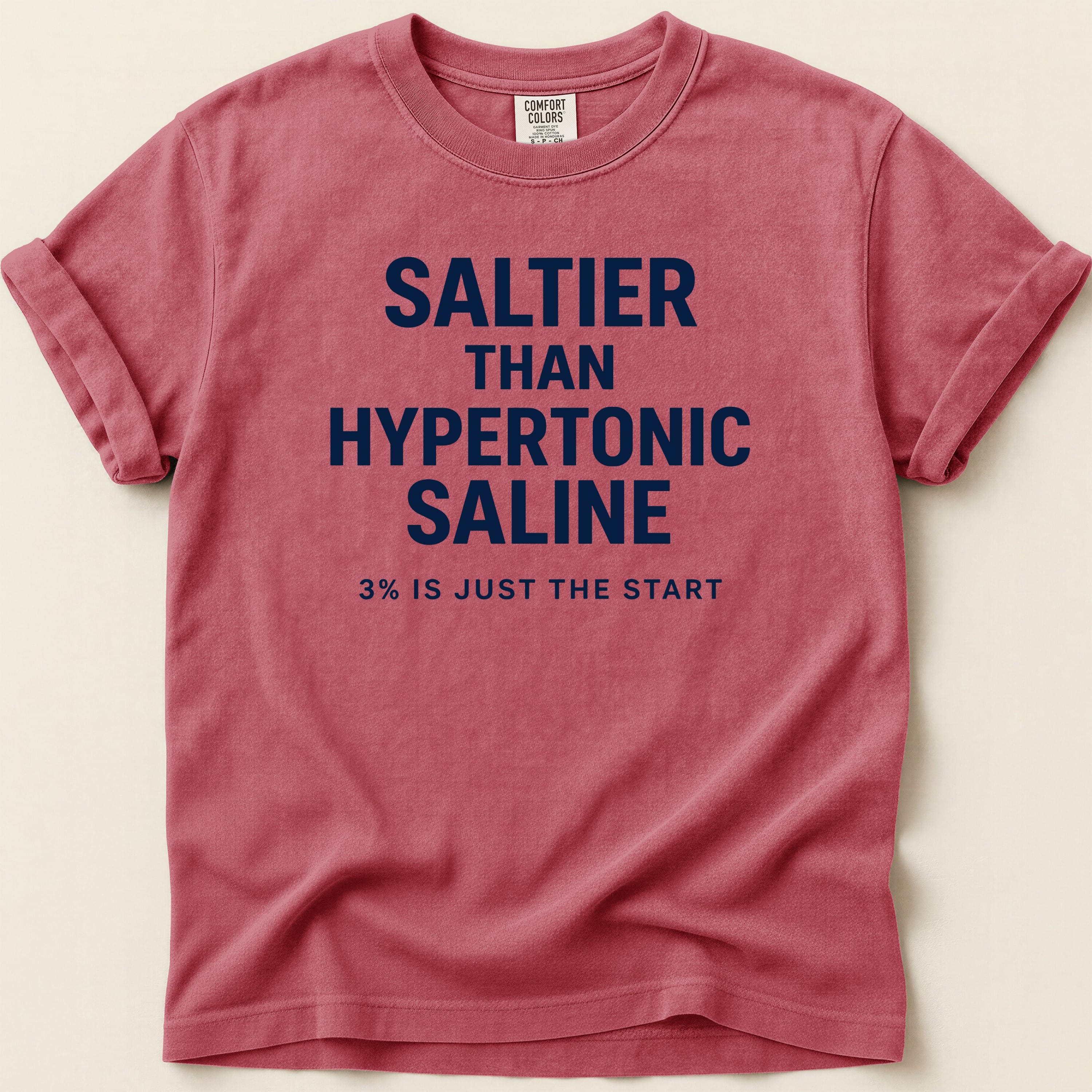 Crimson Comfort Colors t-shirt with "SALTIER THAN HYPERTONIC SALINE" text.