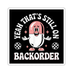 Cartoon capsule character with text "YEAH THAT'S STILL ON BACKORDER".