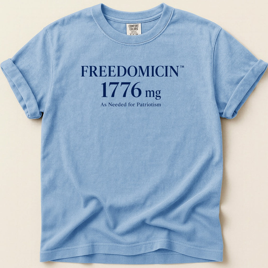 Light blue Comfort Colors t-shirt with "FREEDOMCIN 1776 mg As Needed for Patriotism" text.