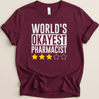 Maroon t-shirt with "WORLD'S OKAYEST PHARMACIST" and three stars.