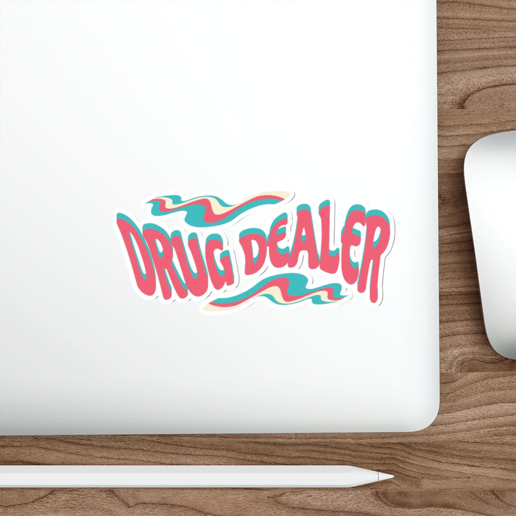 "Drug Dealer" text in wavy, retro-style lettering on a laptop.