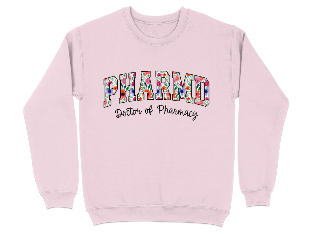Pink sweatshirt with "PHARMD Doctor of Pharmacy" in floral lettering.