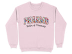 Pink sweatshirt with "PHARMD Doctor of Pharmacy" in floral lettering.