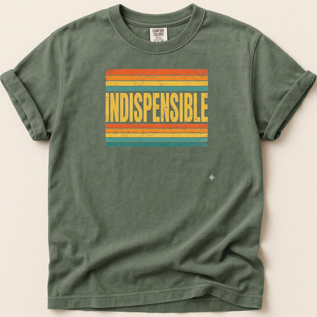 Green t-shirt with "INDISPENSABLE" text on a striped background.