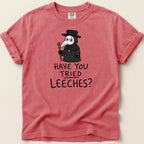 Salmon pink t-shirt with cartoon plague doctor and text "Have You Tried Leeches?".