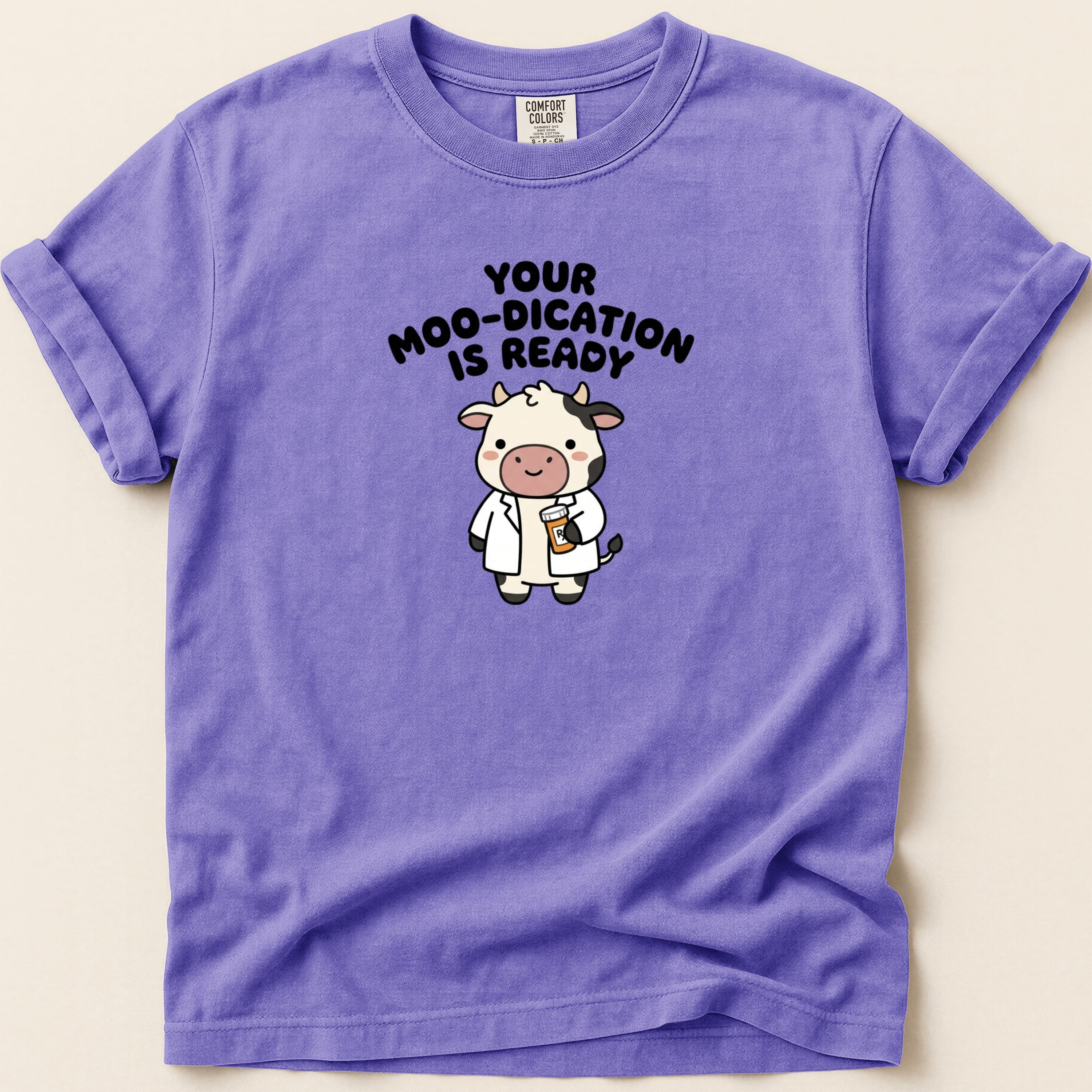 Purple t-shirt with cartoon cow and text "Your Moo-dication Is Ready".