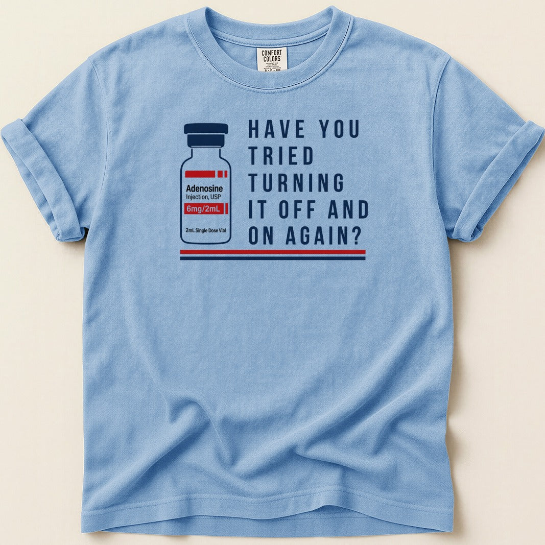 Blue t-shirt with vial graphic and text "Have you tried turning it off and on again?"