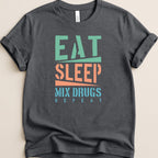 Dark t-shirt with "EAT SLEEP MIX DRUGS REPEAT" text in green, orange, and blue.