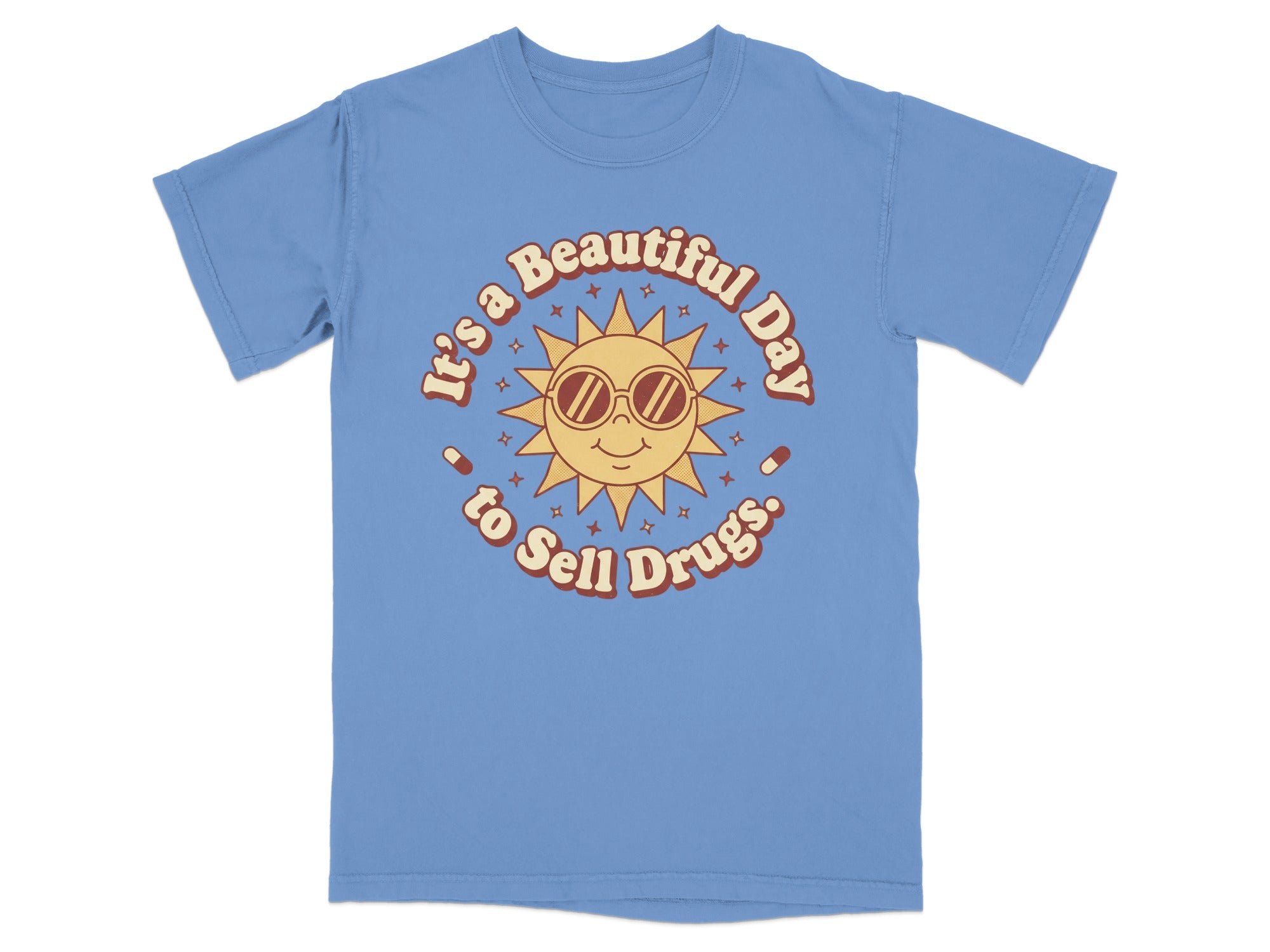 Light blue t-shirt with a retro sun graphic and text reading "It's a Beautiful Day to Sell Drugs."