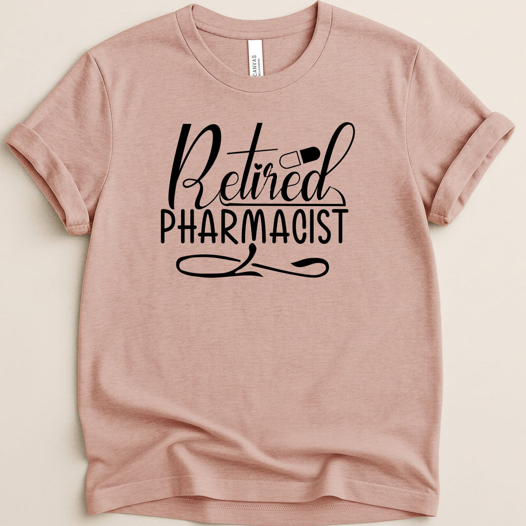 Pink t-shirt with "Retired Pharmacist" text and a pill graphic.