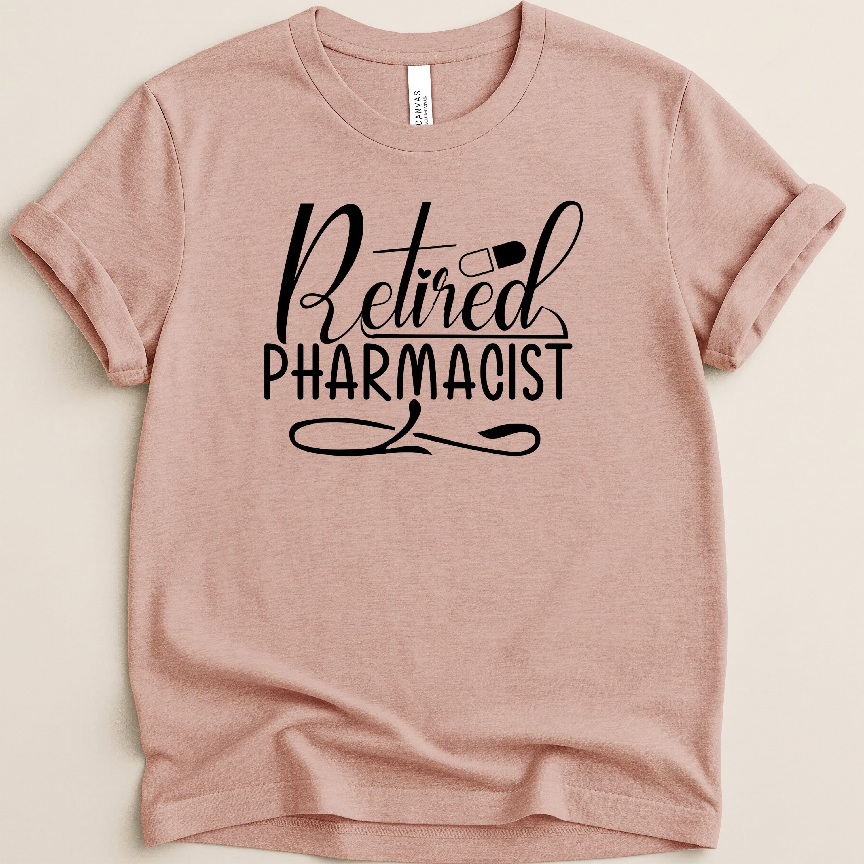 Pink t-shirt with "Retired Pharmacist" text and a pill graphic.