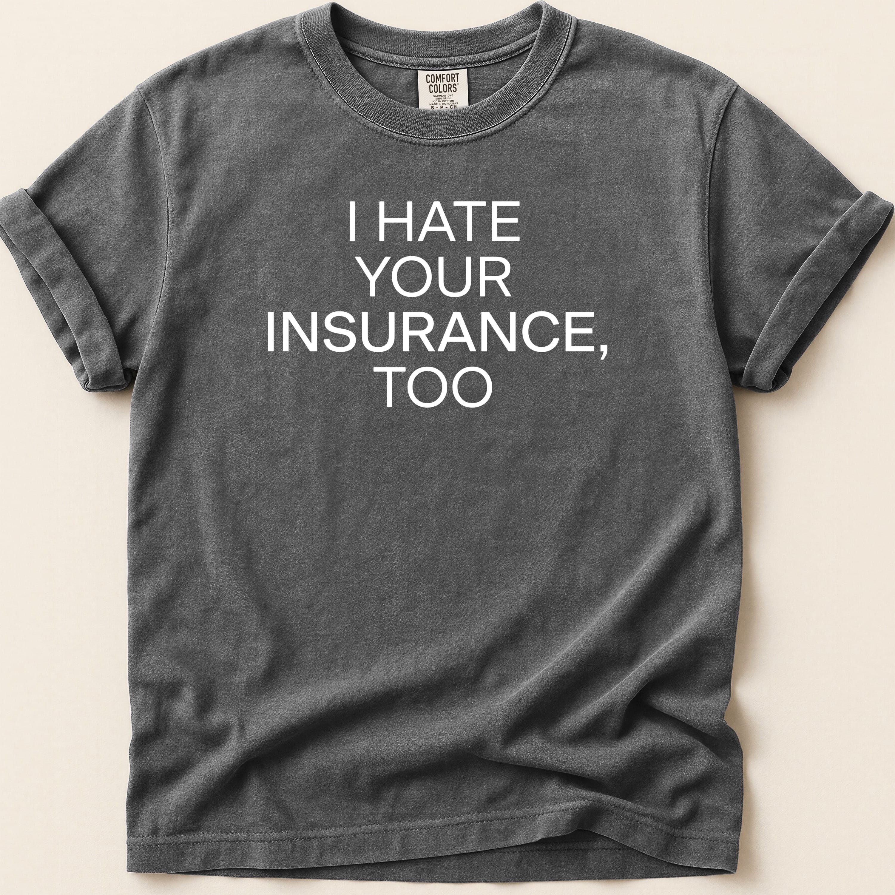 Dark grey t-shirt with "I HATE YOUR INSURANCE, TOO" text.