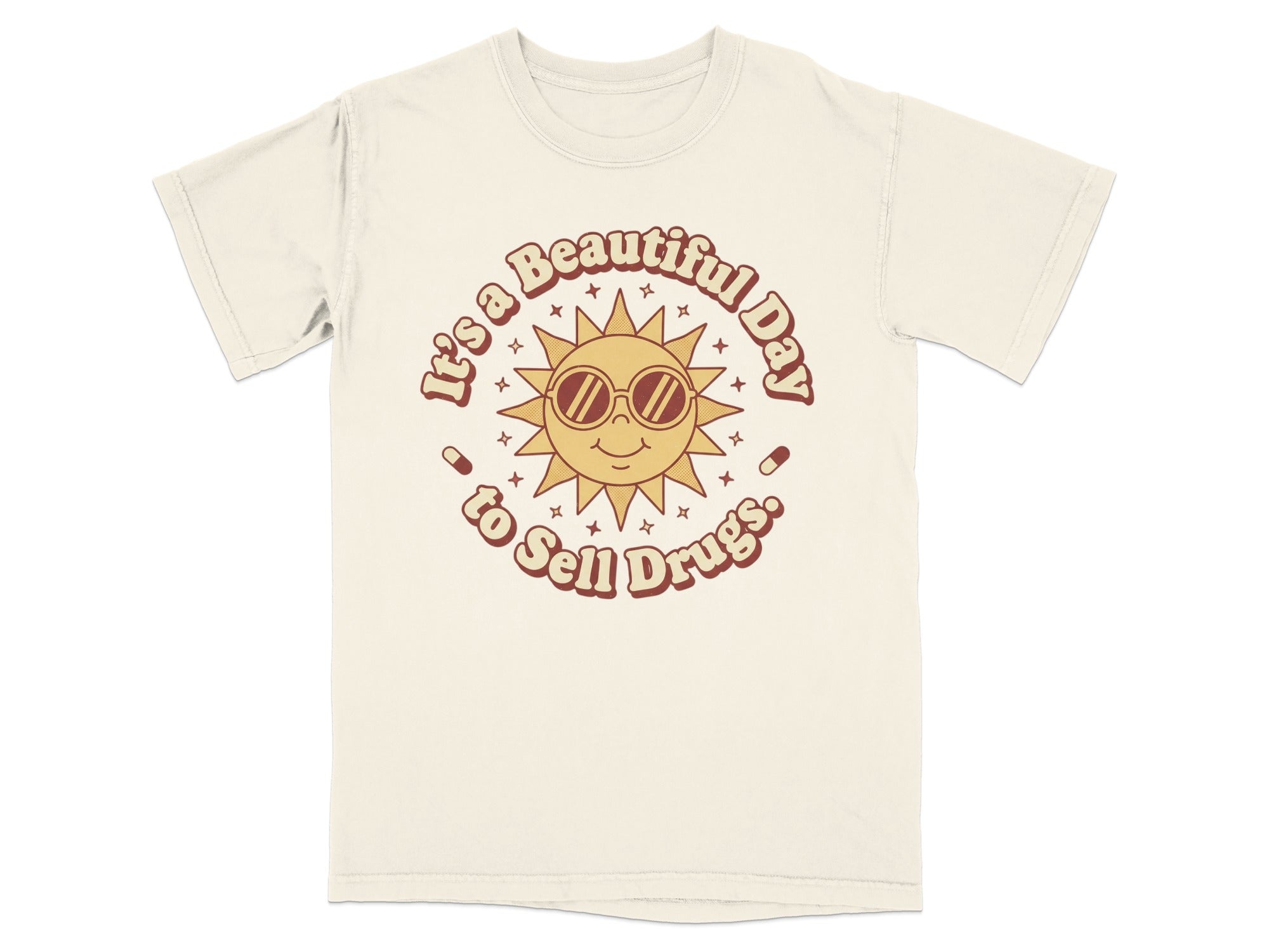 Cream t-shirt with a retro sun graphic that reads "It's a Beautiful Day to Sell Drugs".