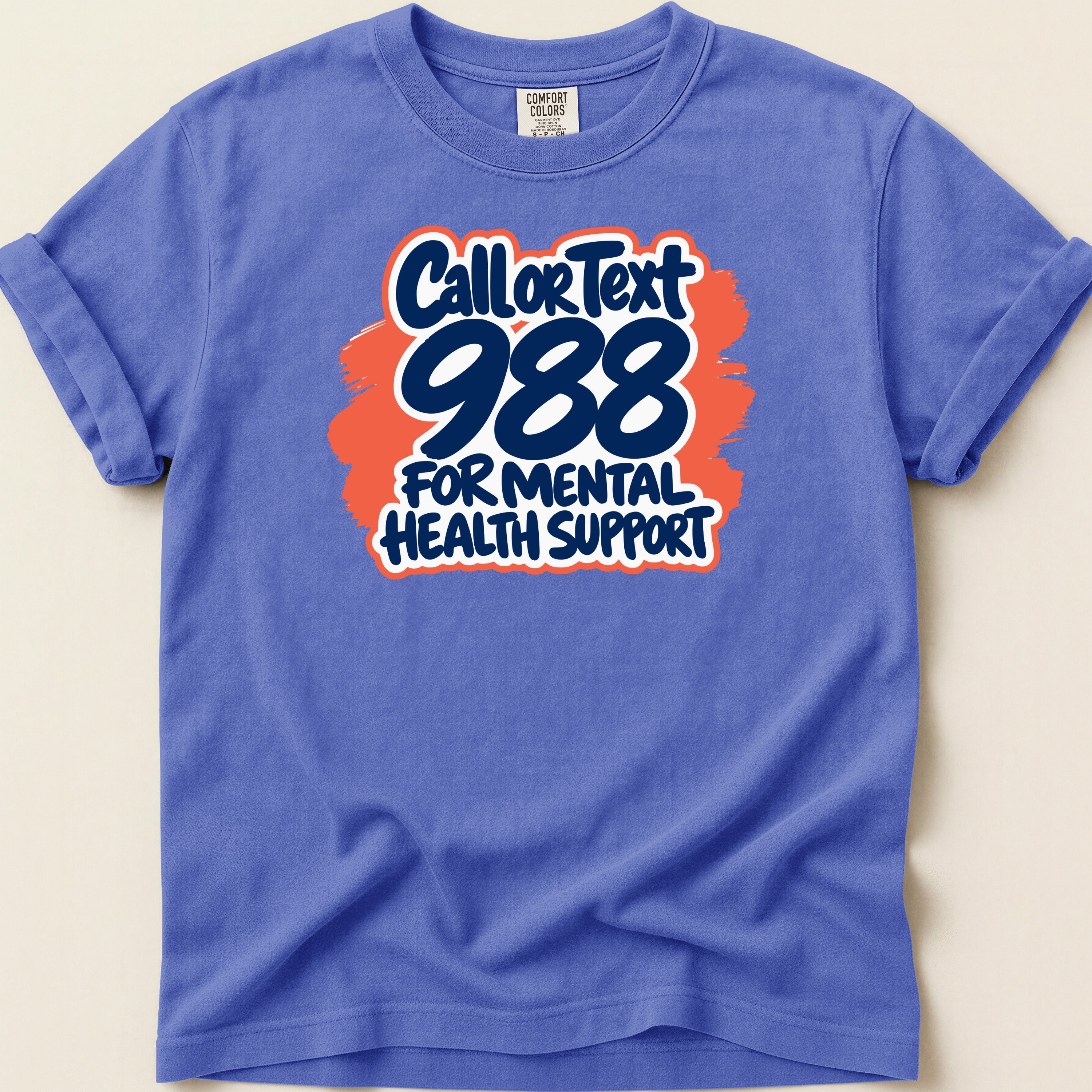 Purple t-shirt with "Call or Text 988 For Mental Health Support" graphic.