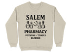 Cream sweatshirt with "Salem Pharmacy Potions - Elixirs" and potion bottle graphics.
