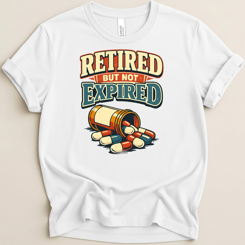 White t-shirt with "Retired But Not Expired" text and spilled pill bottle.