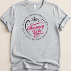 Grey t-shirt with "Pharmacy Life" in a circle of positive attributes.