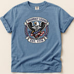 Eagle with American flag and "Pharmacy Legend Est. 1776" emblem on a blue t-shirt.