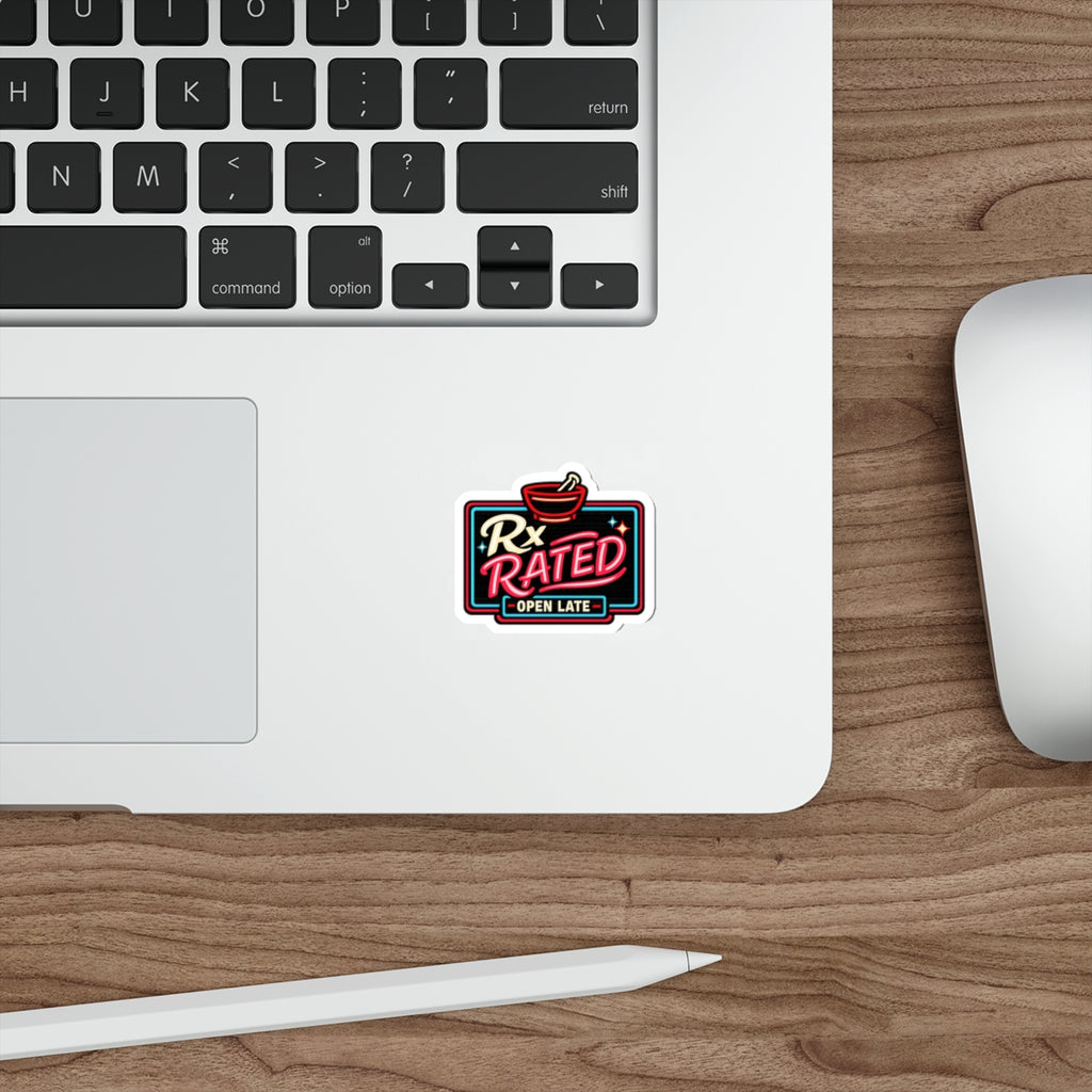 Neon sign for Rx Rated Open Late, placed on a laptop keyboard.