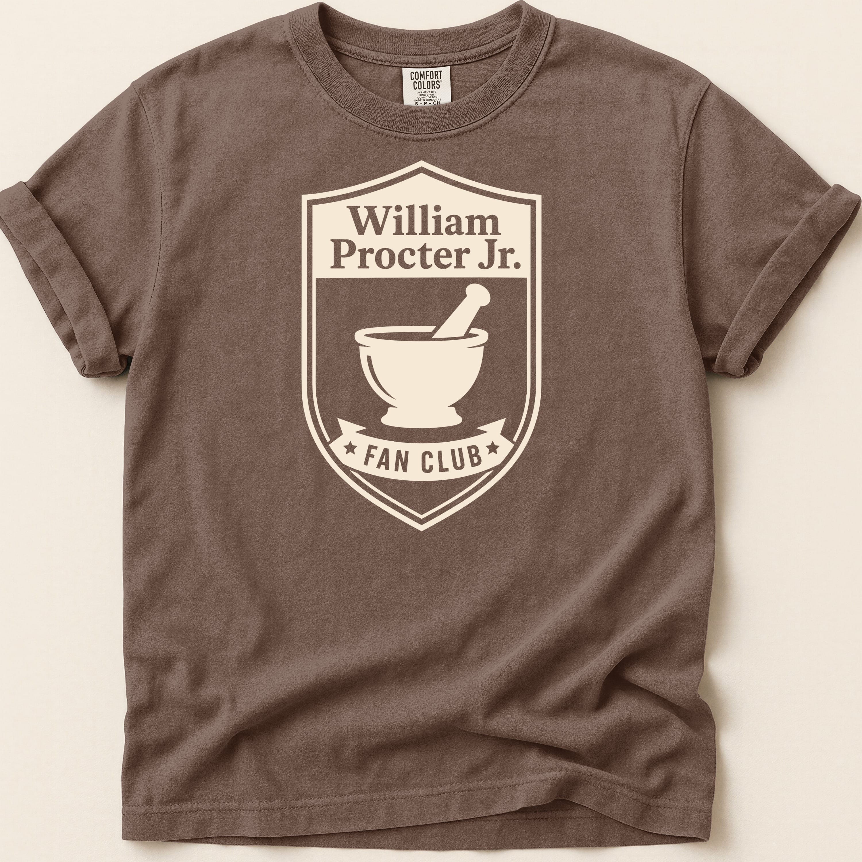 Brown t-shirt with William Procter Jr. Fan Club logo featuring a mortar and pestle.