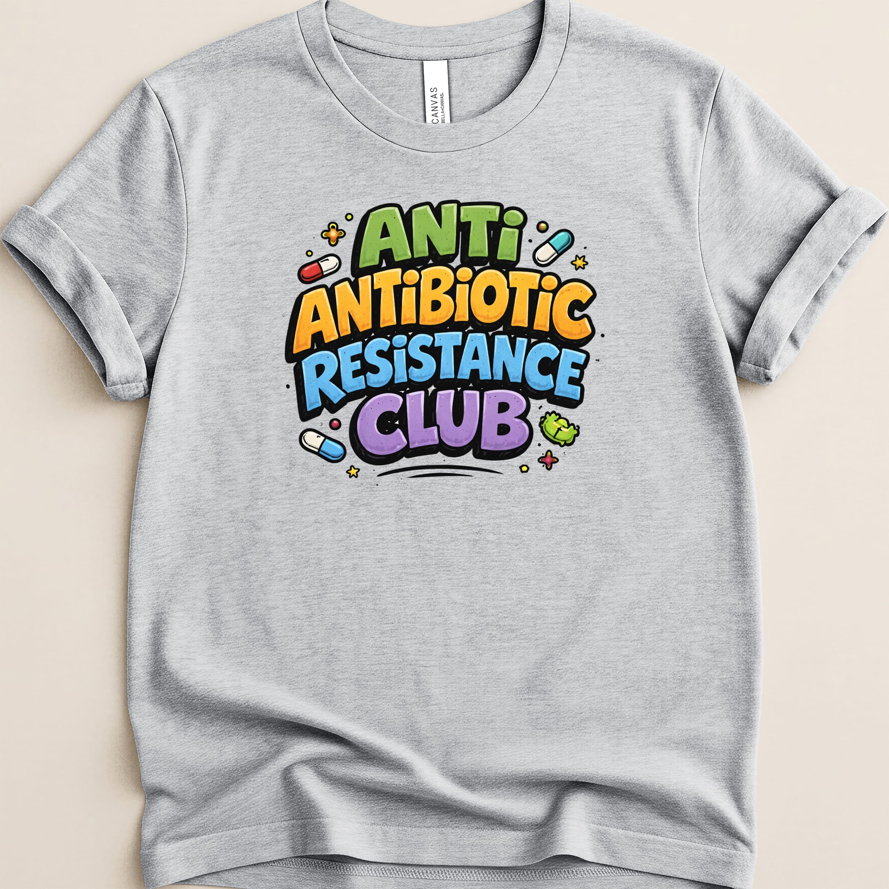 Gray t-shirt with "Anti-Antibiotic Resistance Club" text and colorful pill graphics.