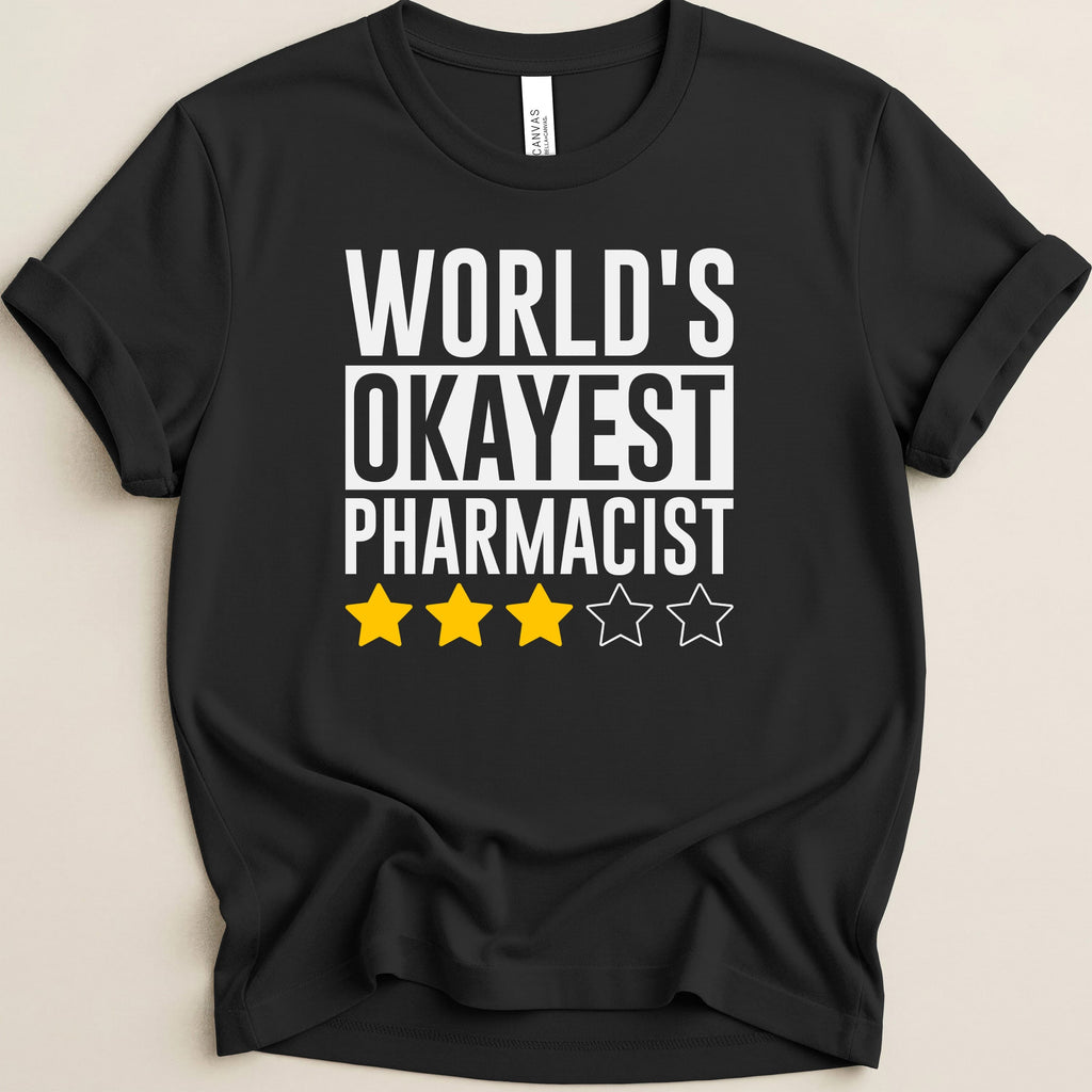 Black t-shirt with "World's Okayest Pharmacist" and three yellow stars.