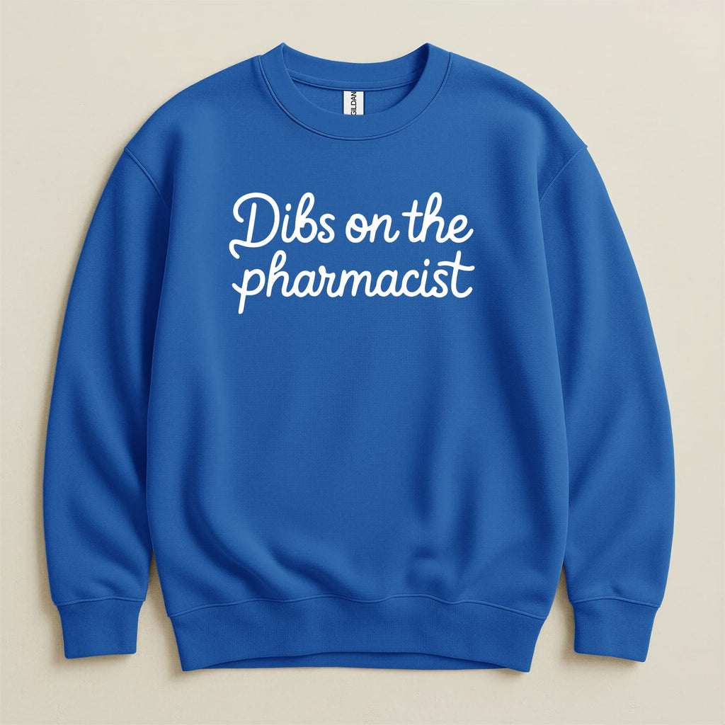 Blue crewneck sweatshirt with "Dibs on the pharmacist" text.