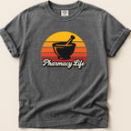 Dark gray t-shirt with "Pharmacy Life" and a mortar and pestle on a sunset graphic.