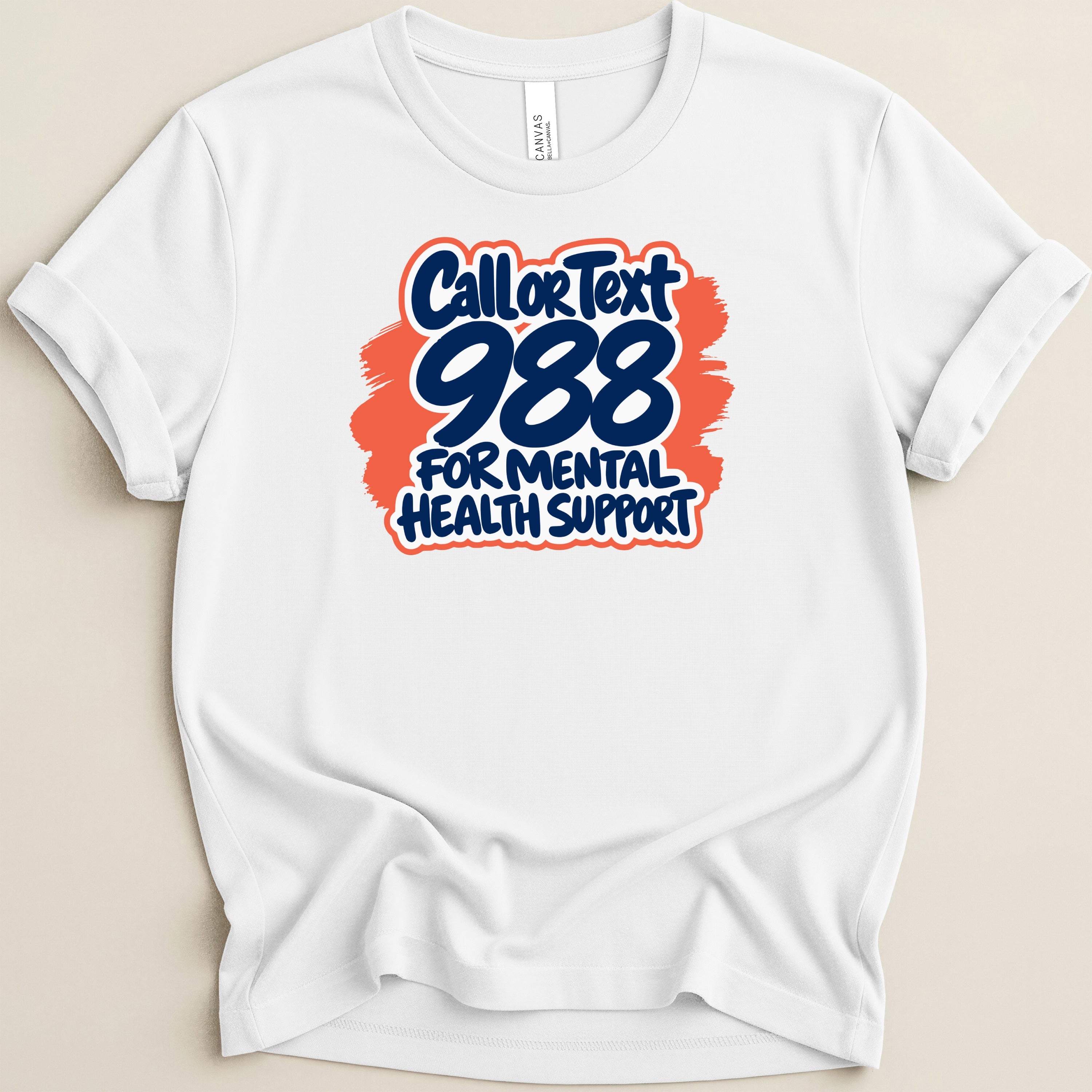 White t-shirt featuring "Call or Text 988 for Mental Health Support" graphic.