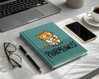 Teal notebook with cartoon cat in lab coat and "PHARMEOWCIST" text.