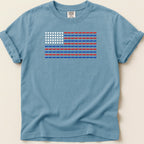 Blue t-shirt with American flag design made of red and white pills.