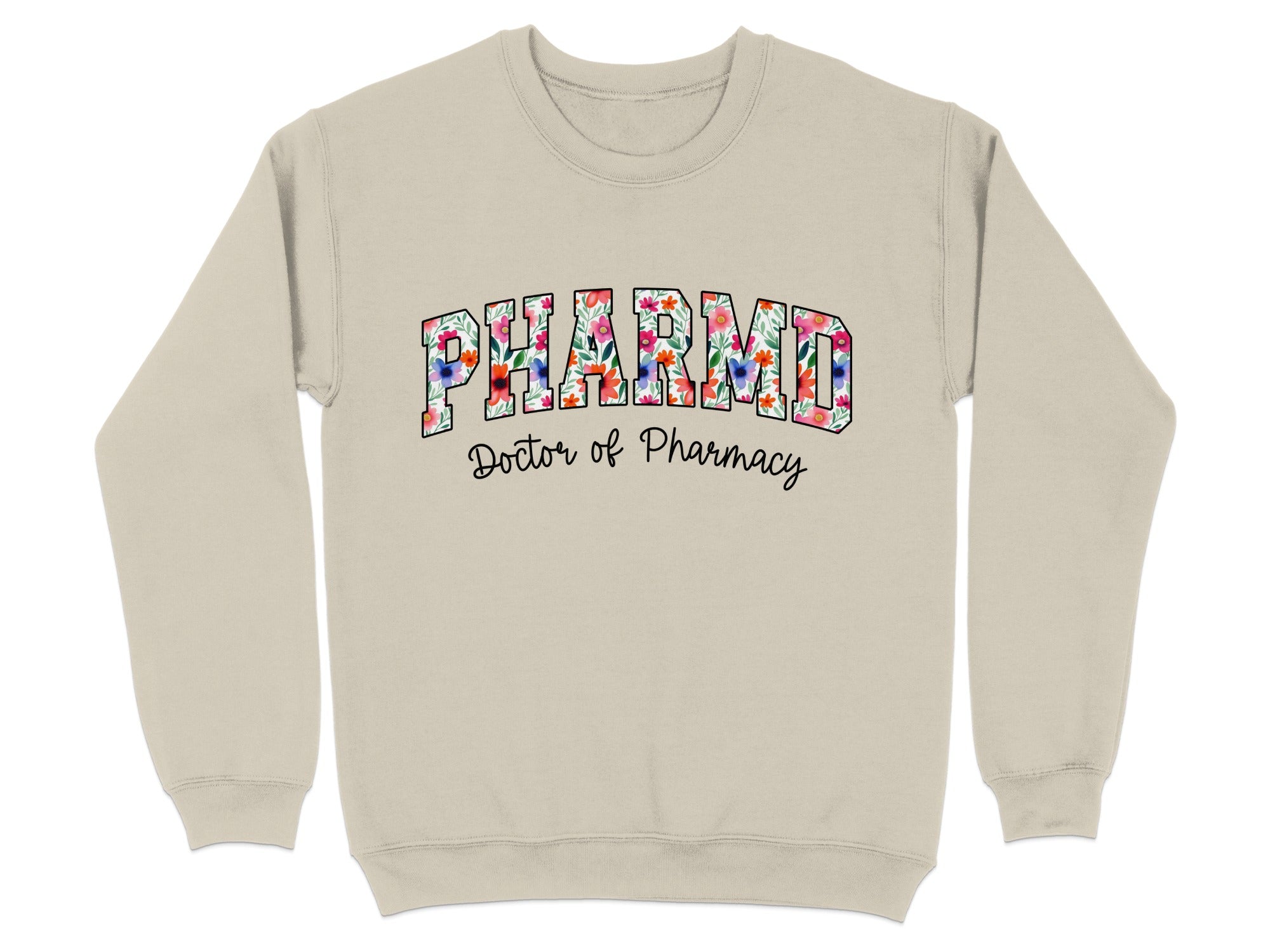 "PharmD Doctor of Pharmacy" text on a tan crewneck sweatshirt with floral accents.