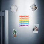 Rainbow text spelling "pharmacy" stacked vertically on a refrigerator.