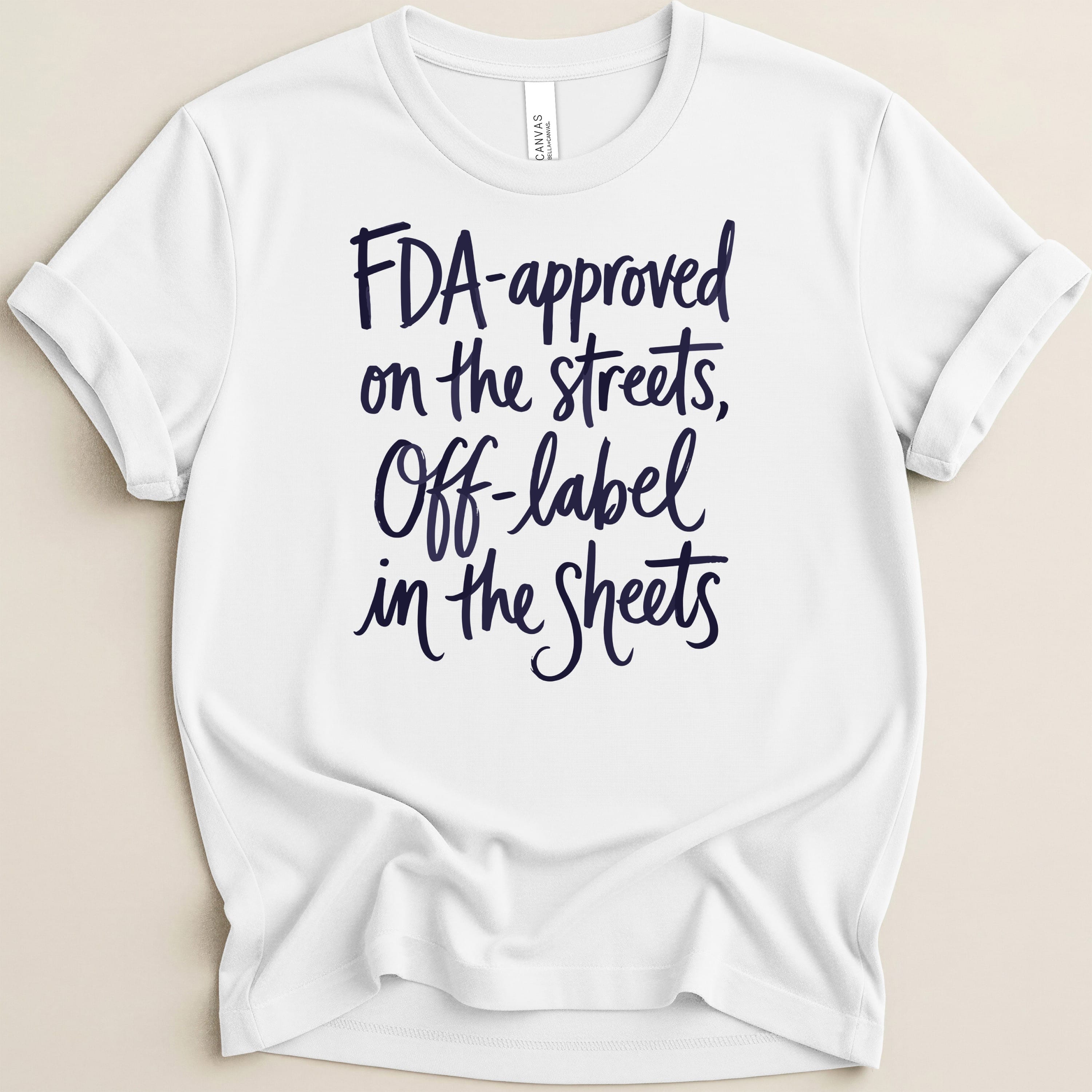 White t-shirt with dark blue text "FDA-approved on the streets, Off-label in the Sheets."