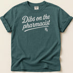 Teal t-shirt with "Dibs on the pharmacist" and "Rx" graphic.