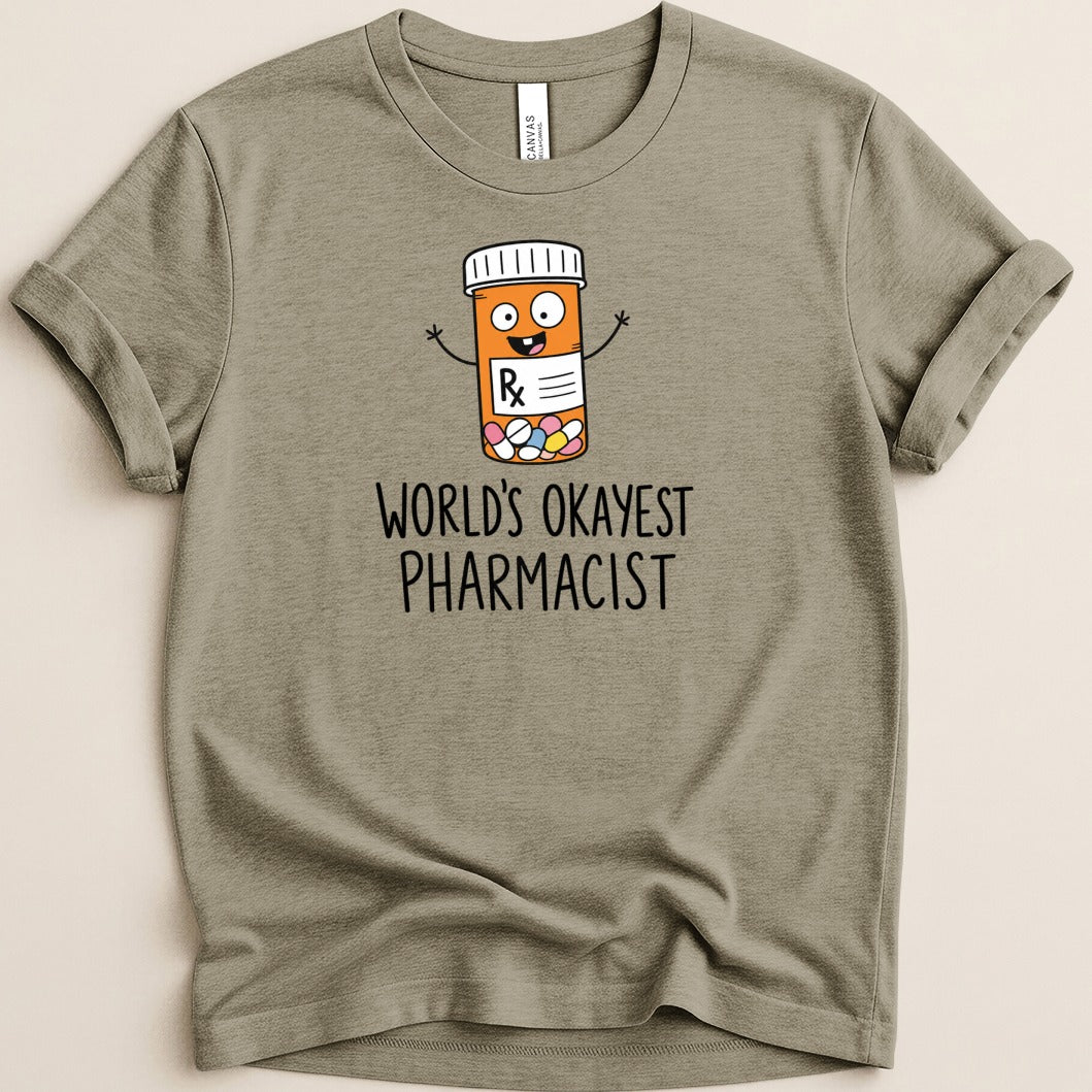 T-shirt with cartoon pill bottle and text "World's Okayest Pharmacist".