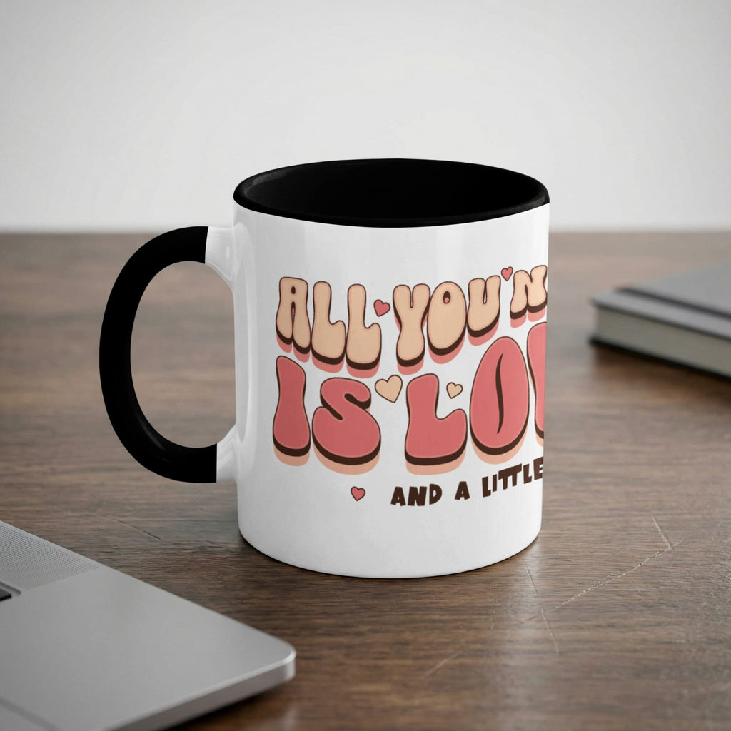 Mug with "All you need is love and a little coffee" text.