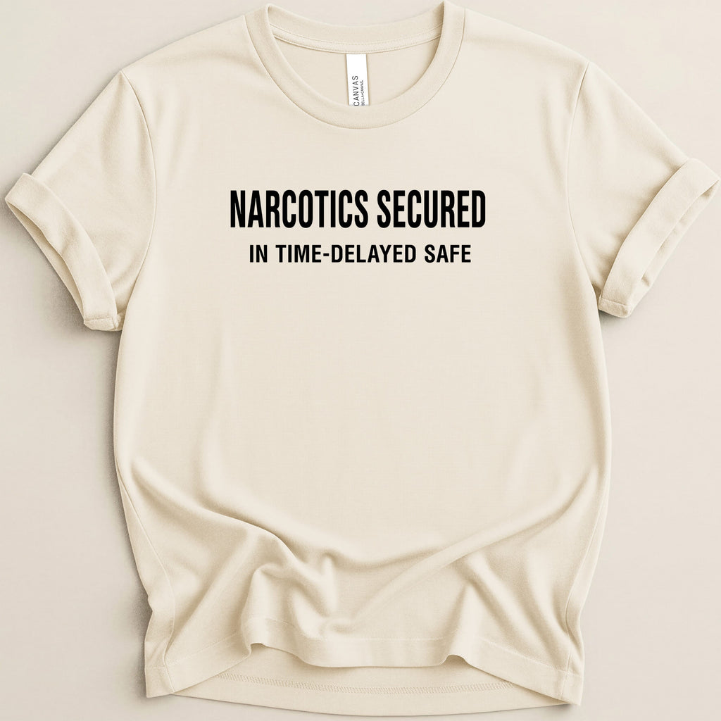 Cream t-shirt with black text: NARCOTICS SECURED IN TIME-DELAYED SAFE