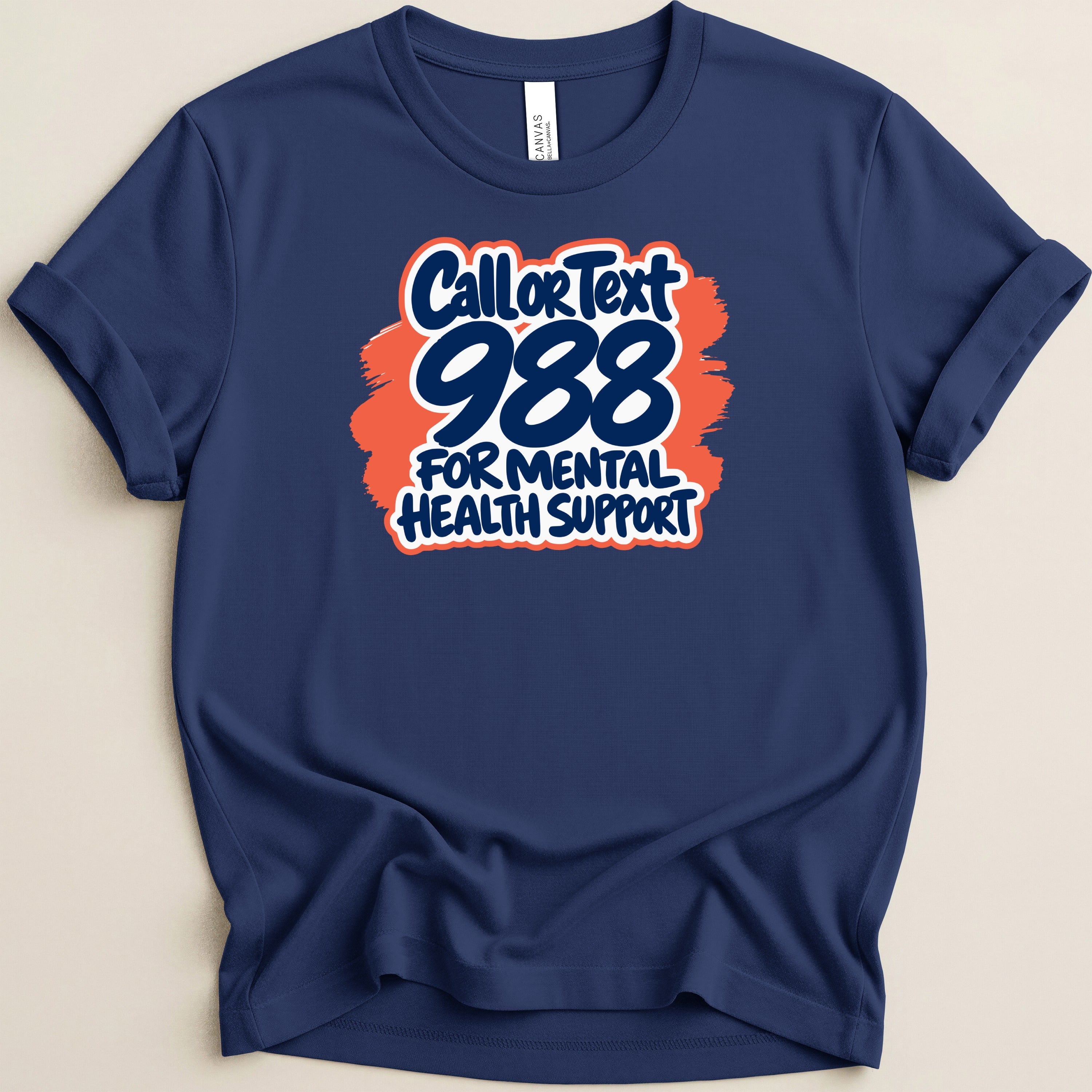 Navy t-shirt with white and orange "Call or Text 988 for Mental Health Support" graphic.