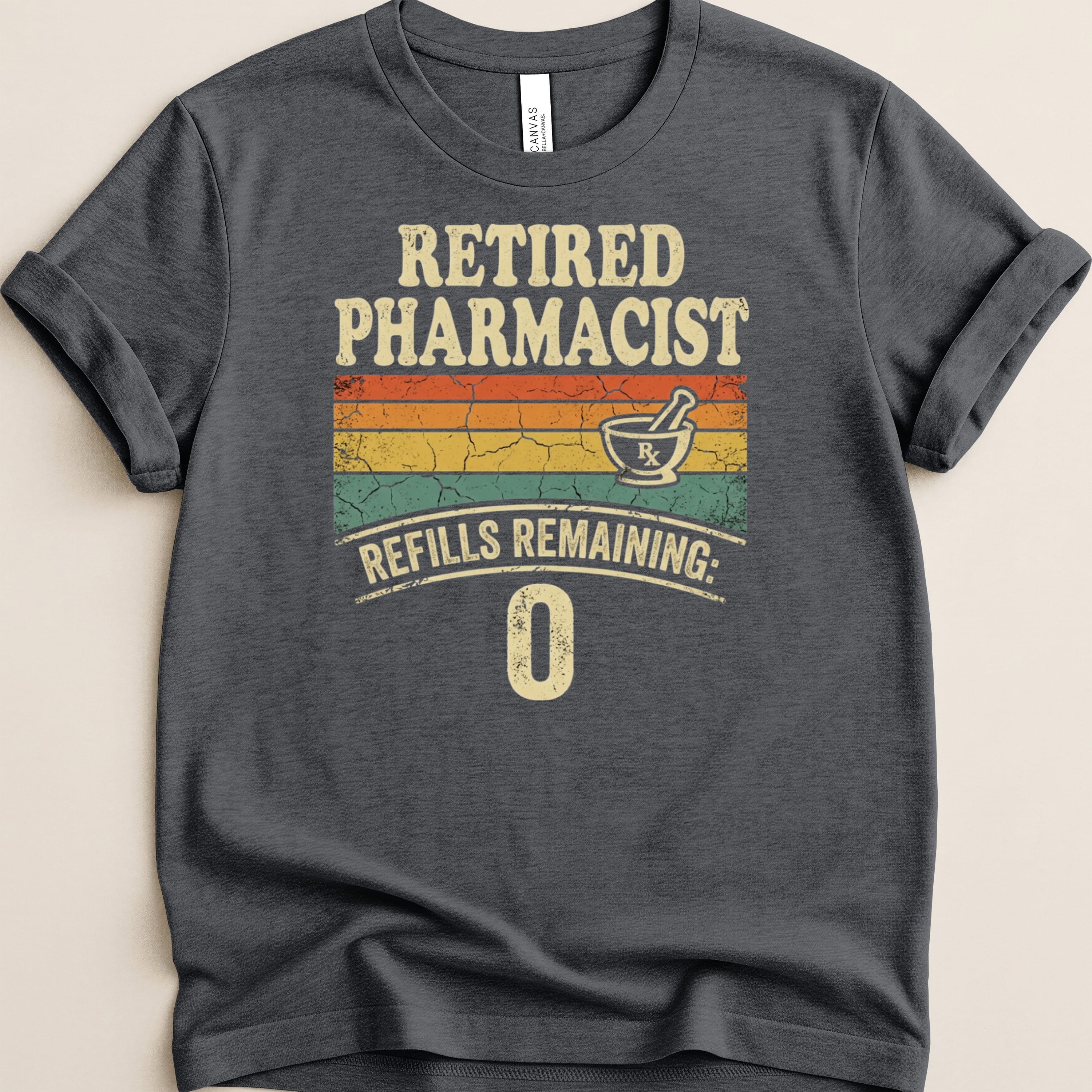 Dark t-shirt with "Retired Pharmacist Refills Remaining: 0" text and Rx mortar and pestle.
