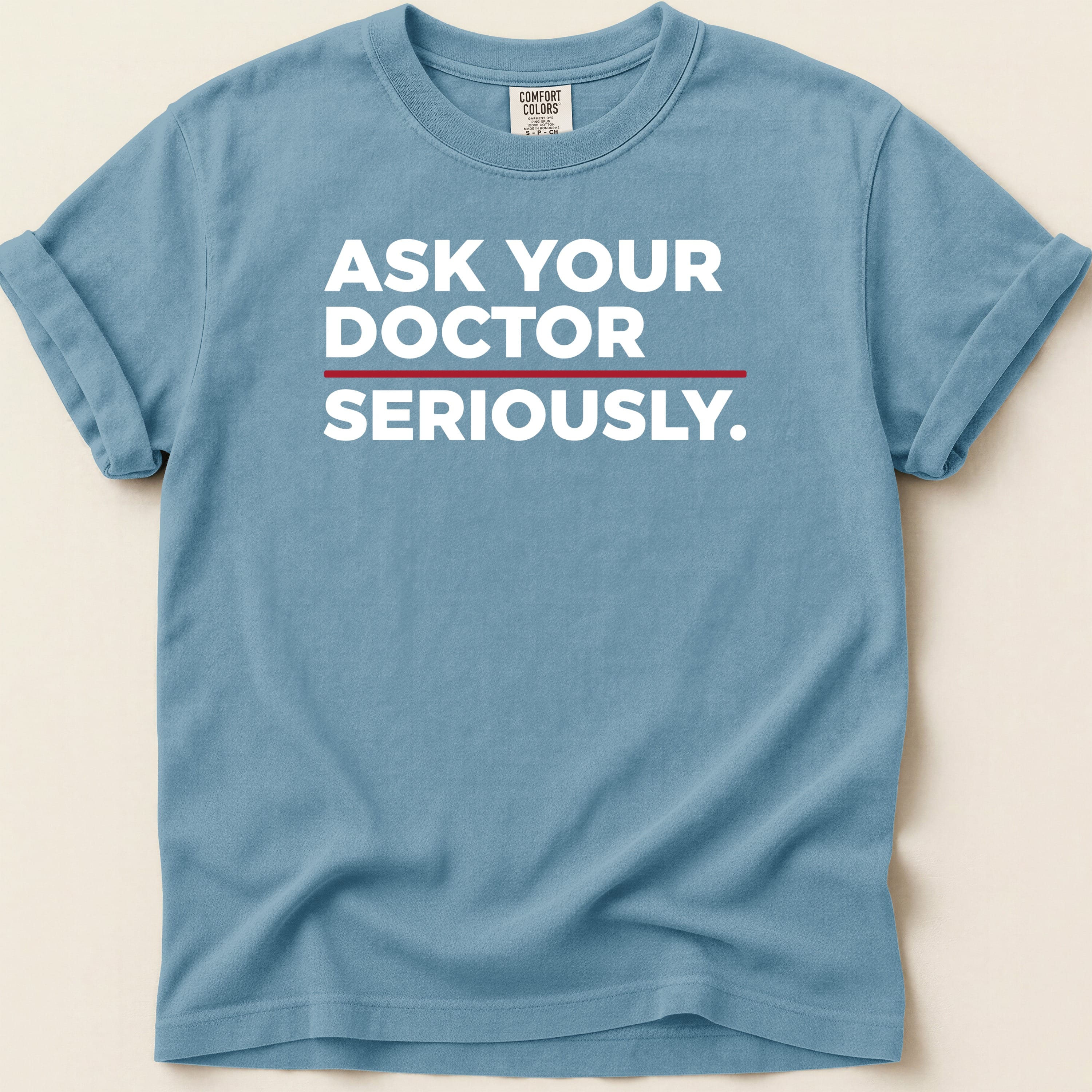 Blue t-shirt with white text "ASK YOUR DOCTOR SERIOUSLY."