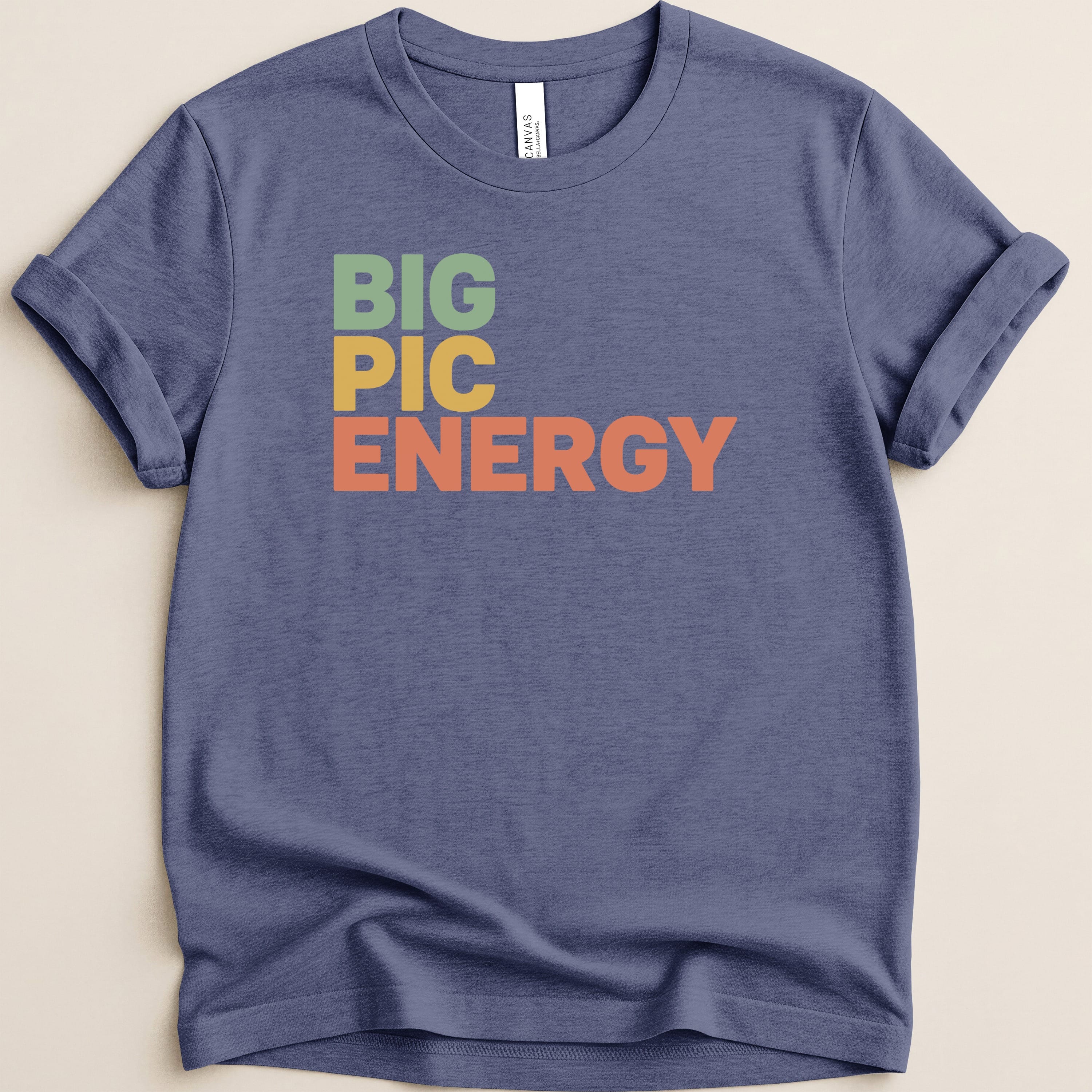 Navy t-shirt with "BIG PIC ENERGY" in colorful letters.
