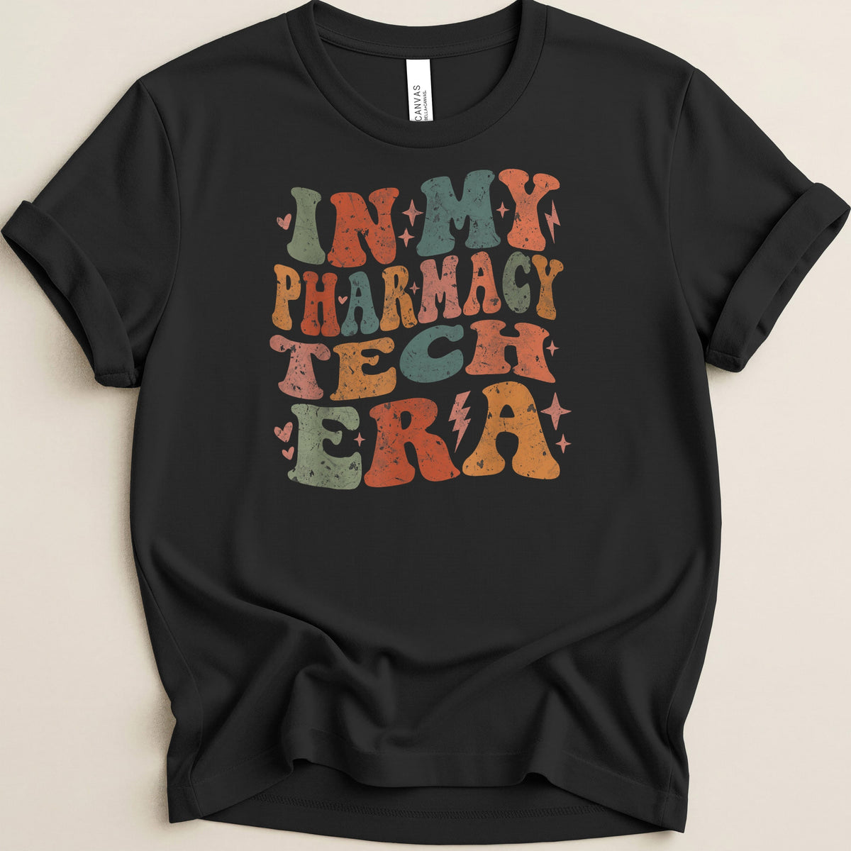 Black t-shirt with retro-style text "In My Pharmacy Tech Era".