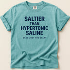Teal t-shirt with "SALTIER THAN HYPERTONIC SALINE 3% IS JUST THE START" text.