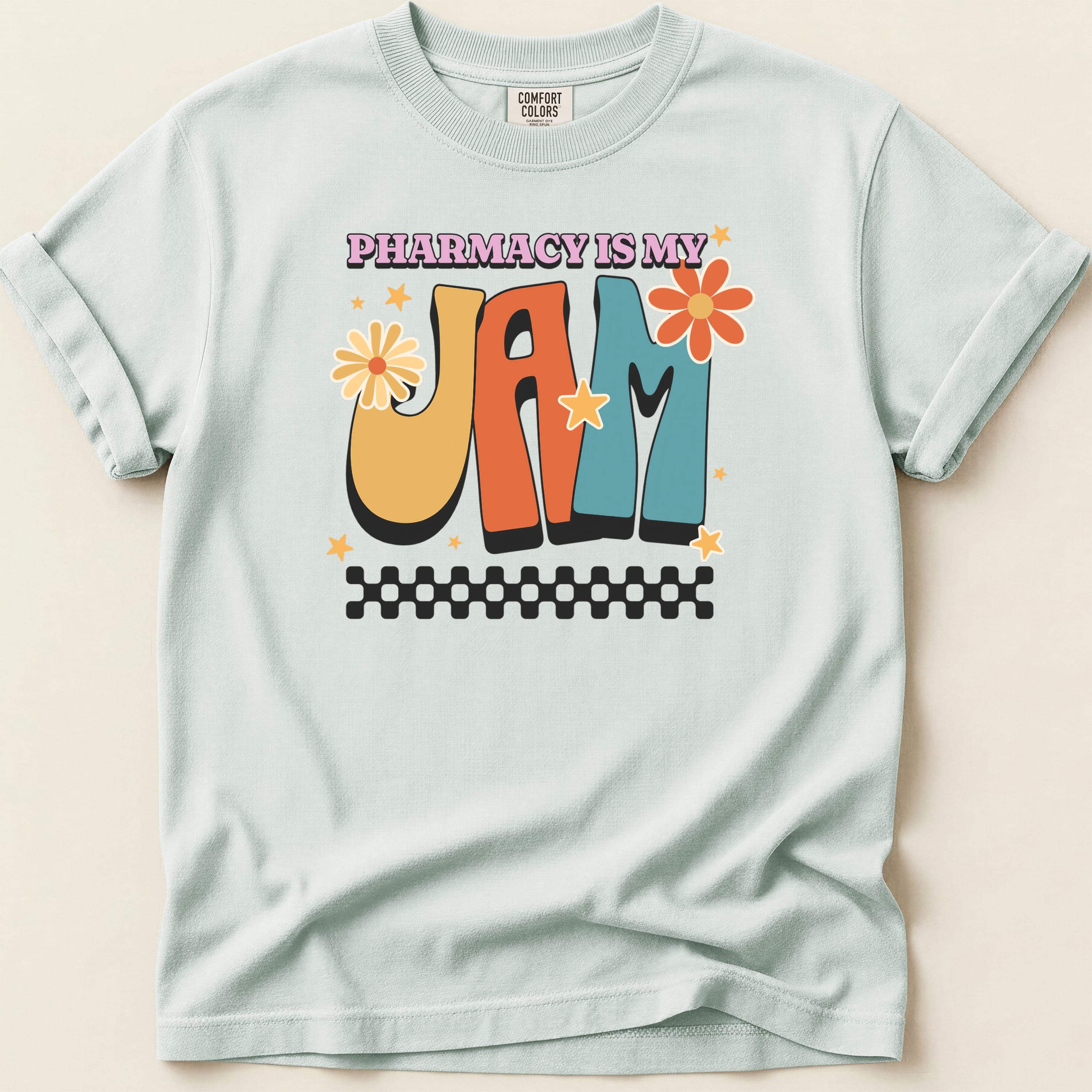 "Pharmacy is my Jam" text with retro graphic on light blue t-shirt.