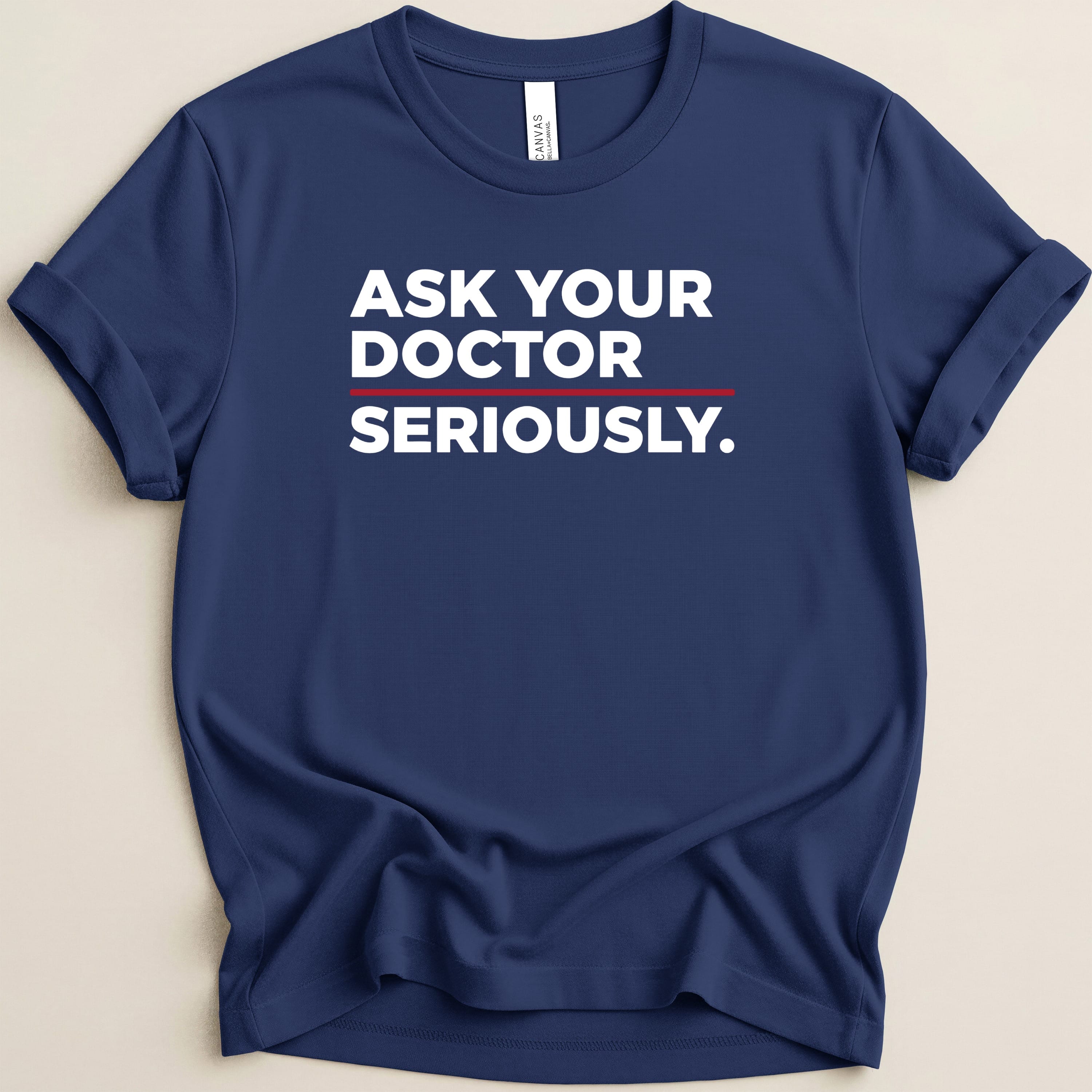 Navy t-shirt with "ASK YOUR DOCTOR SERIOUSLY." text in white and red.