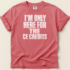 Coral t-shirt with white distressed text "I'M ONLY HERE FOR THE CE CREDITS".