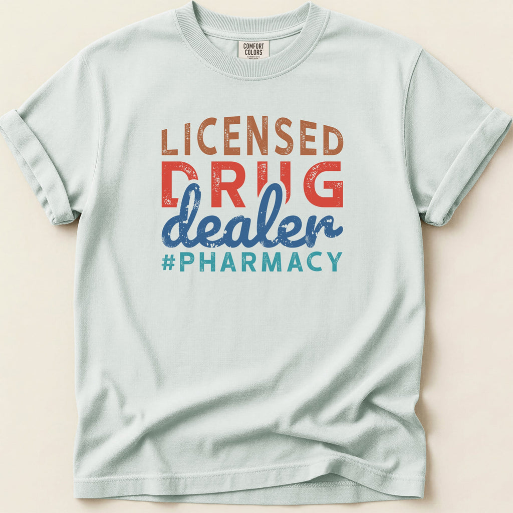 Light blue t-shirt with "LICENSED DRUG DEALER #PHARMACY" text.